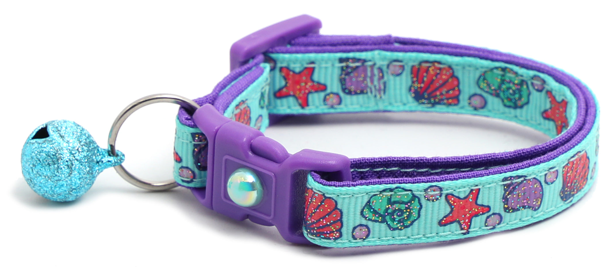 Beachcomber Breakaway Cat Collar in vibrant colors, featuring a breakaway clip and removable bell, made from soft reinforced cotton.